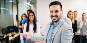 bbg boss smiling with employees