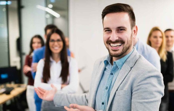 bbg boss smiling with employees